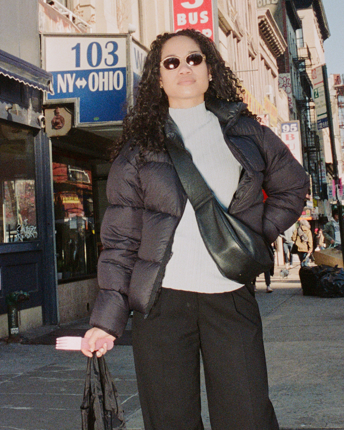 forks-plus-just-a-fork-pink-fork-pink-sleeve-kristine Girl holding pink acrylic fork with silicone sleeve in the city
